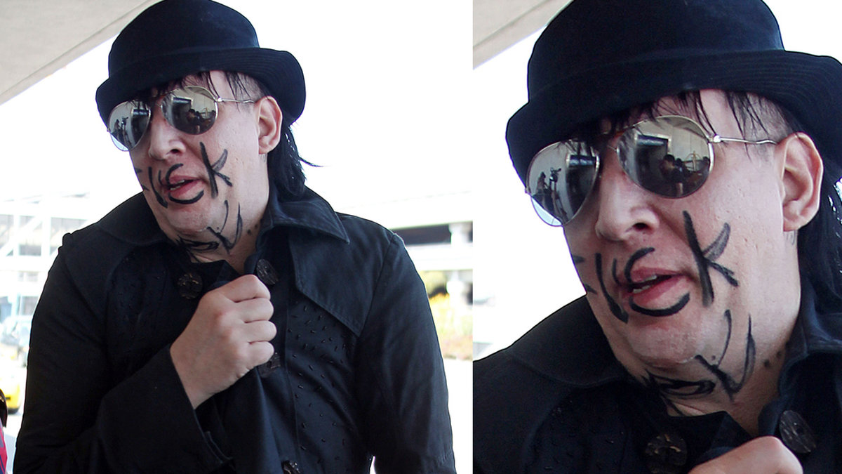 Marilyn Mansons outfit är vanlig rockgubbe på flygplats. Men hans ansiktsmålning? 