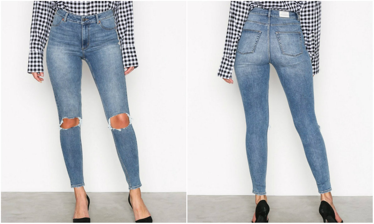 Höga tighta jeans knähål Höga tighta jeans knähål