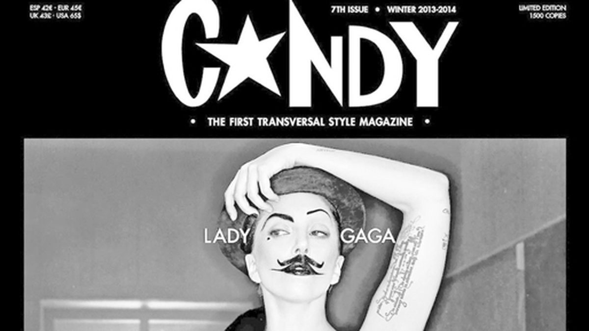 En mustaschprydd Lady Gaga poserade spritt språngande naken på omslaget till Candy.